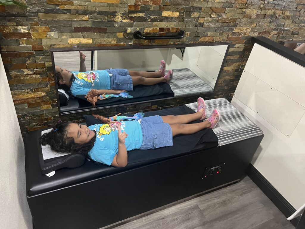 young girl having a poor posture treatment